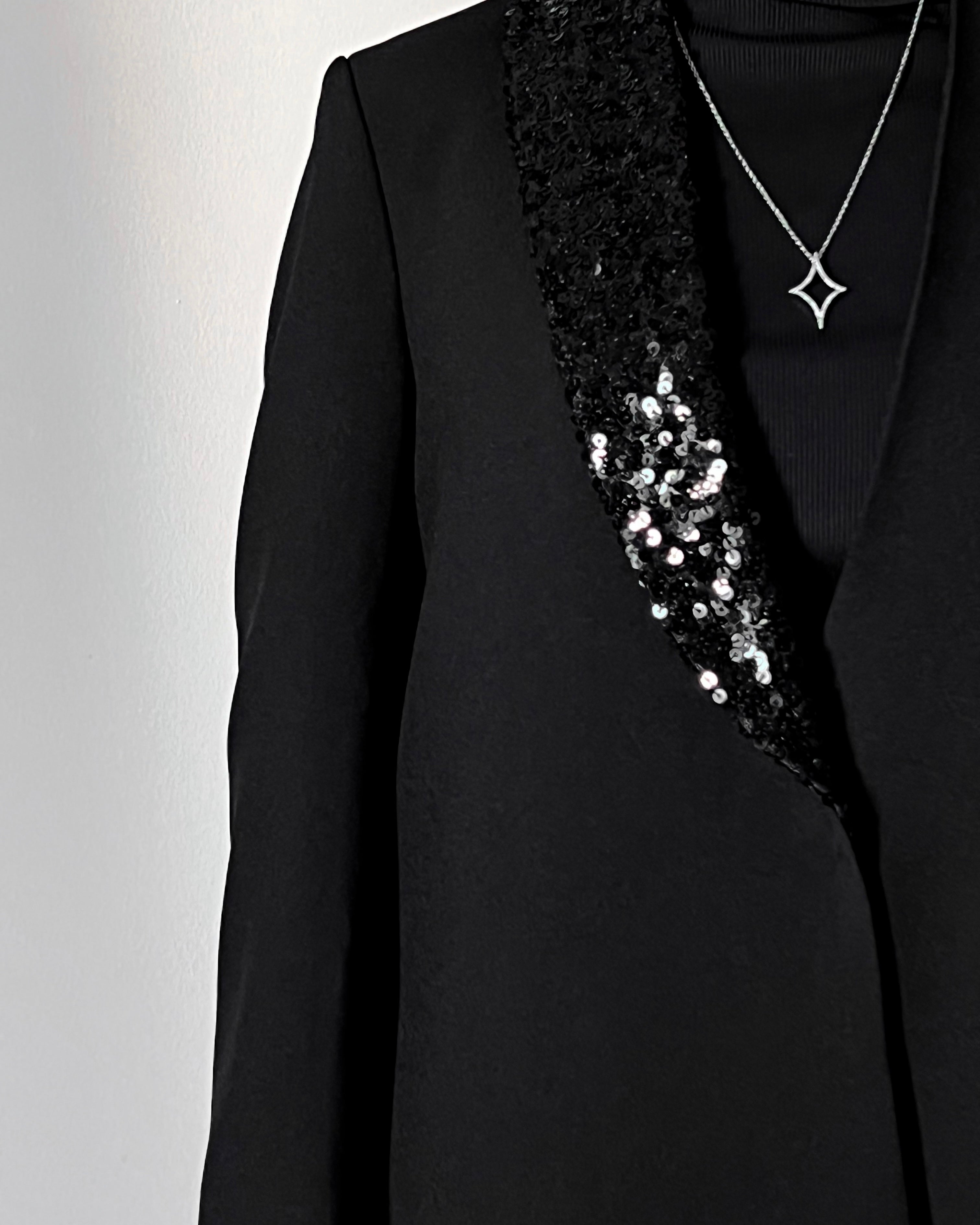 Blazer cut abaya crafted from premium crepe, finished with a sequin detailed on one side collar.