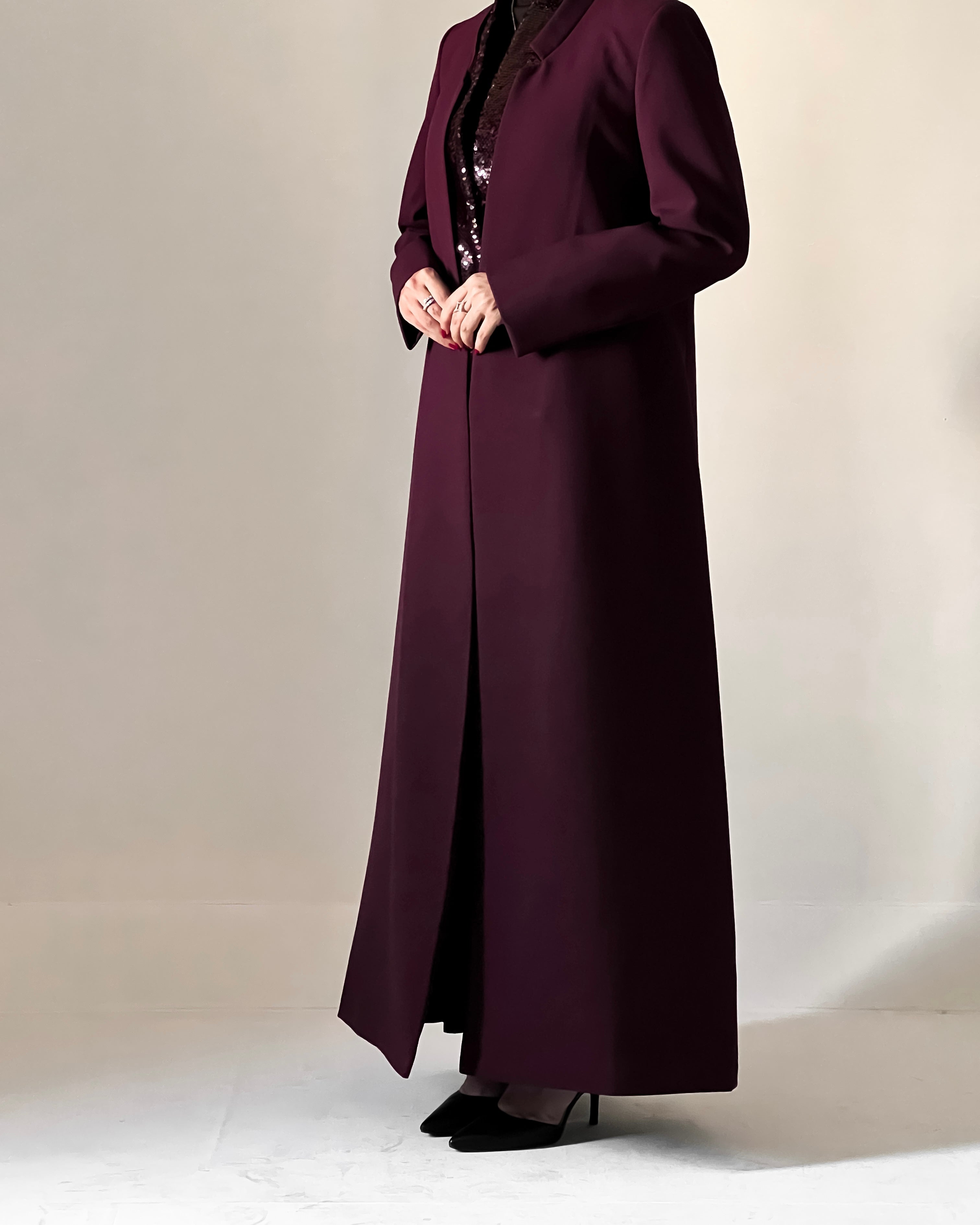 Blazer cut abaya crafted from premium crepe, finished with a sequin detailed inside collar.