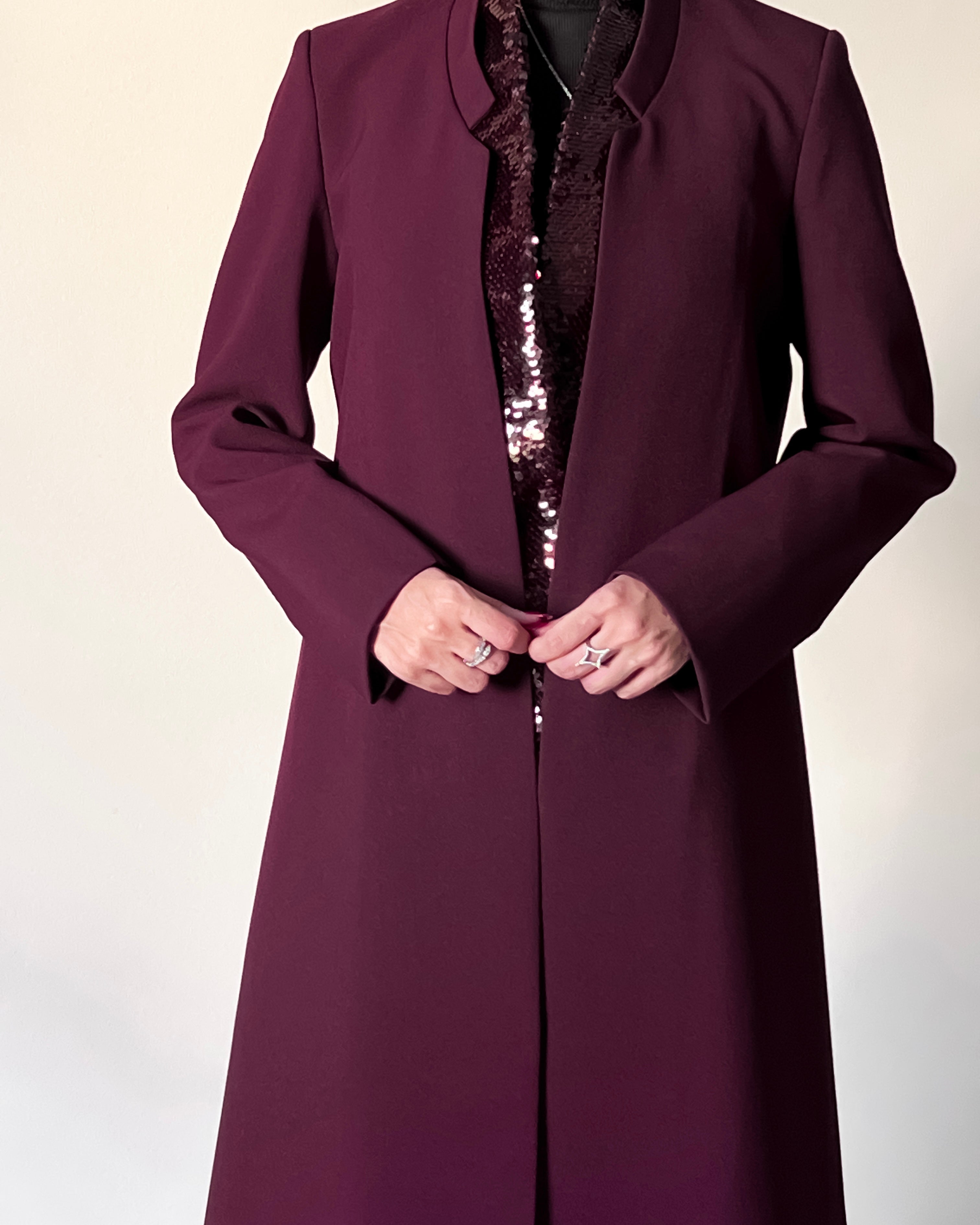 Blazer cut abaya crafted from premium crepe, finished with a sequin detailed inside collar.