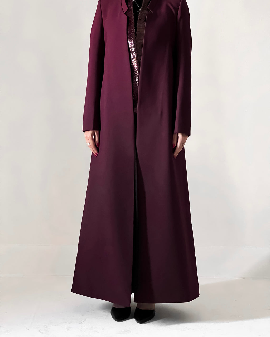 Blazer cut abaya crafted from premium crepe, finished with a sequin detailed inside collar.