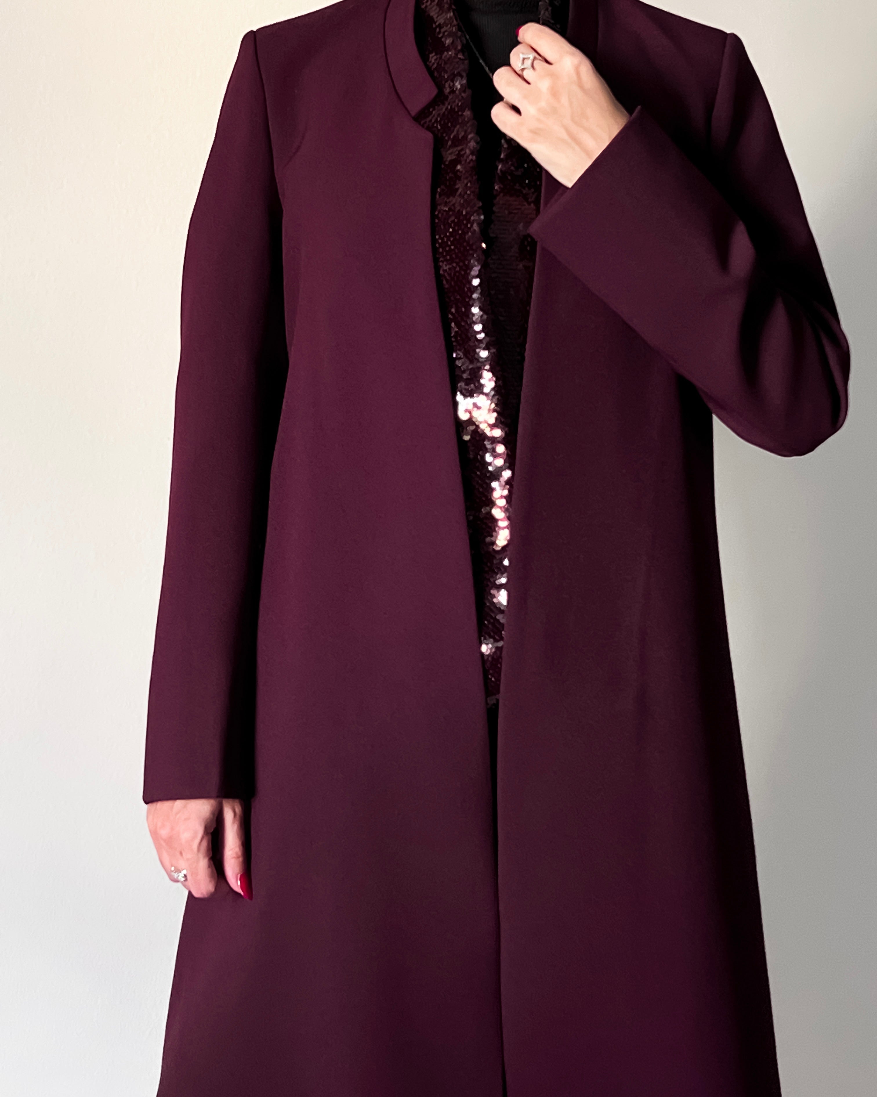 Blazer cut abaya crafted from premium crepe, finished with a sequin detailed inside collar.