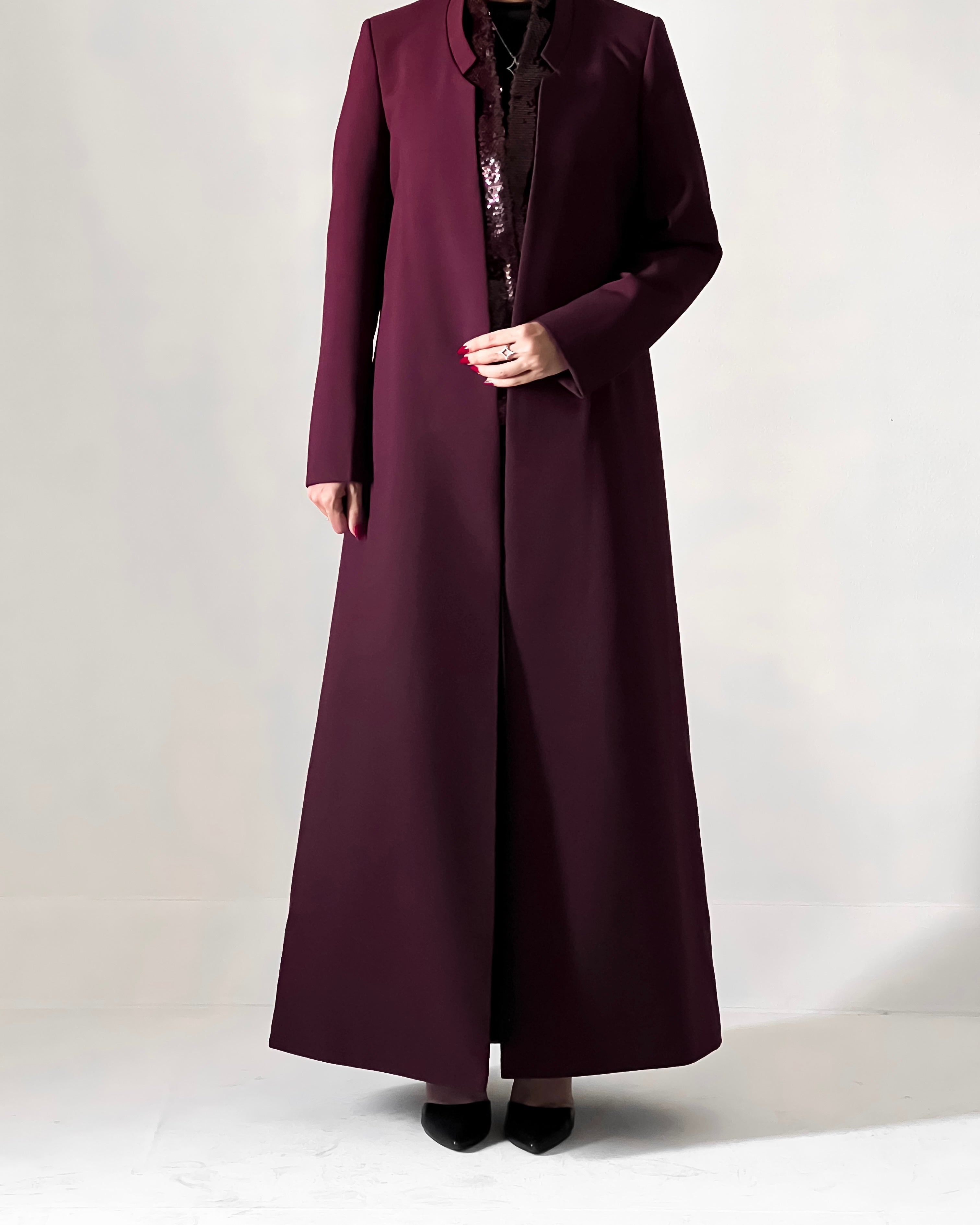 Blazer cut abaya crafted from premium crepe, finished with a sequin detailed inside collar.