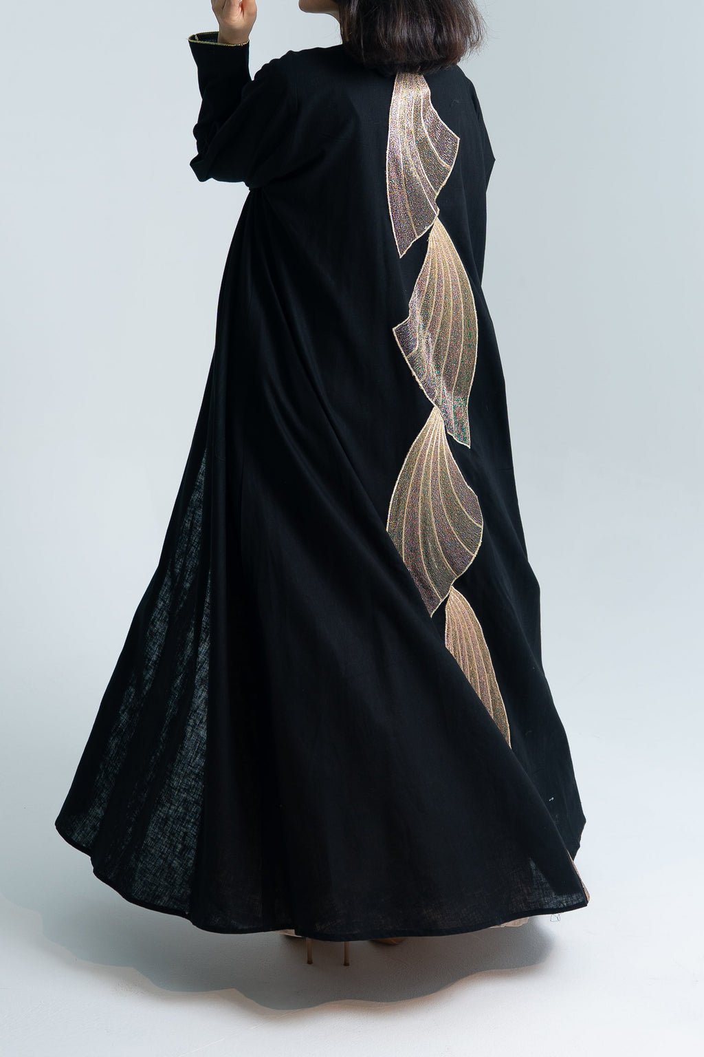A cut Linen abaya with gold embroidery